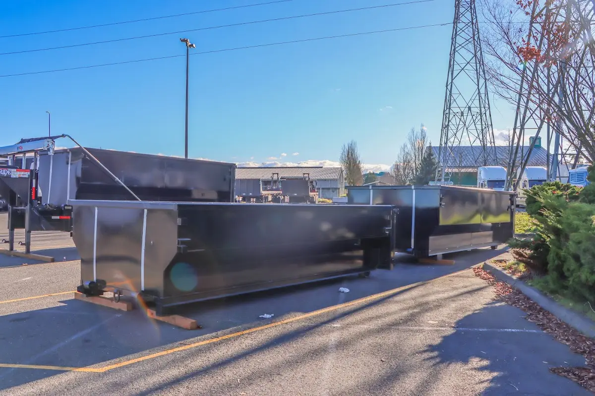Roll-off dumpster ready for waste disposal at job site for Concrete Dumpster Rental in Sheffield Lake